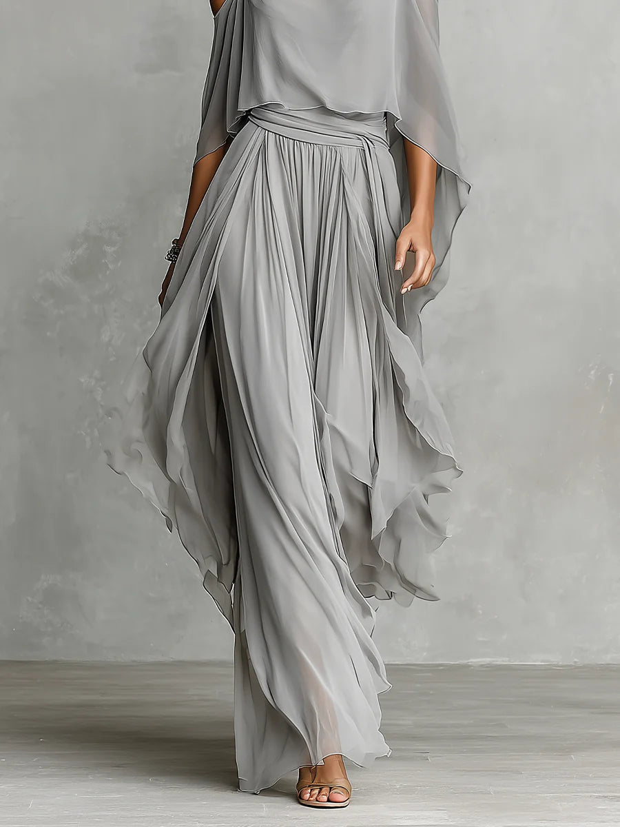 Conjunto elegante gris de blusa de gasa descubierta de los hombros y pantalones de pierna ancha